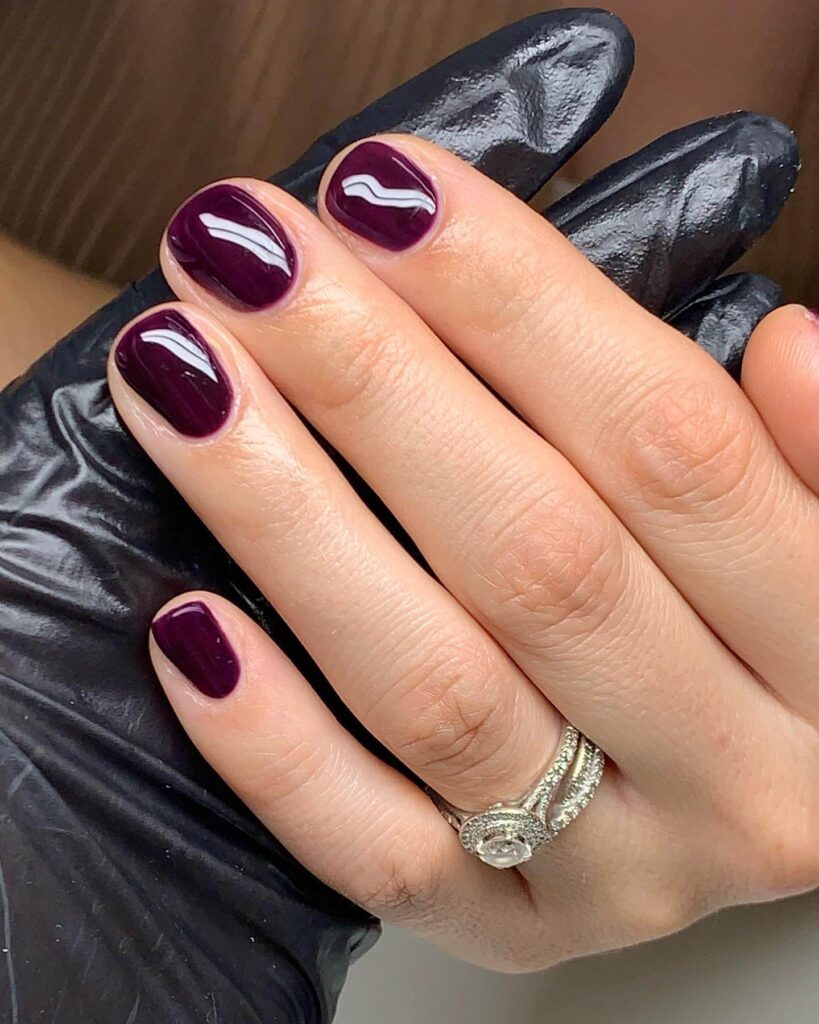 dark nails featuring burgundy, black ombre, and fall nail designs.