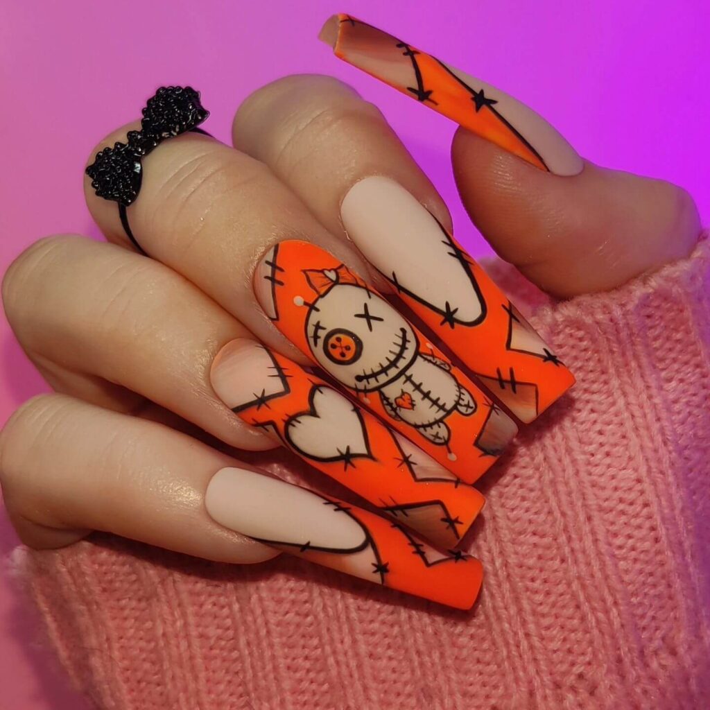 Stylish dark orange nails featuring chic fall designs perfect for autumn vibes.