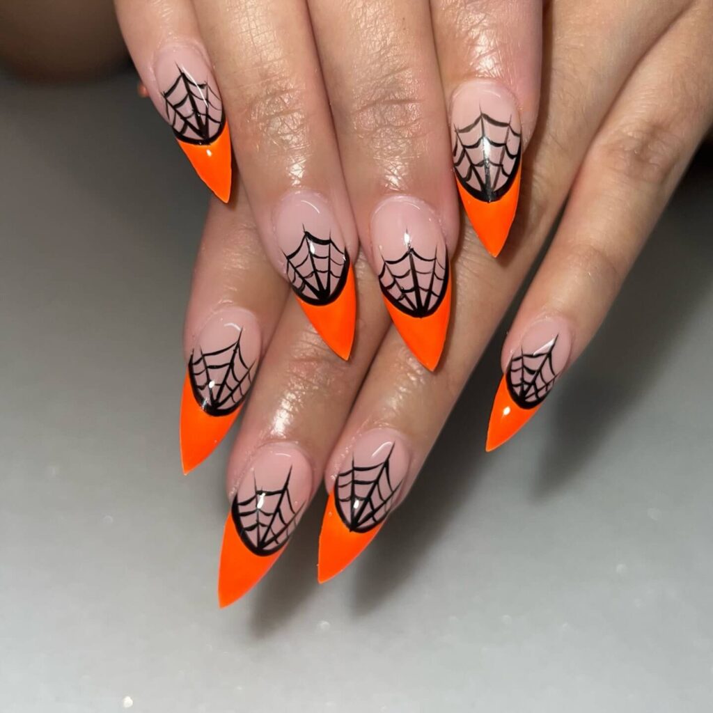 Stylish dark orange nails featuring chic fall designs perfect for autumn vibes.