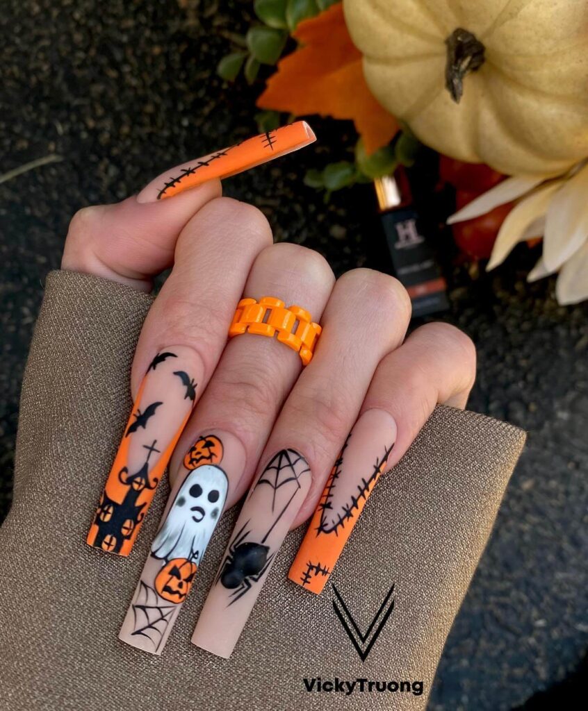 Stylish dark orange nails featuring chic fall designs perfect for autumn vibes.