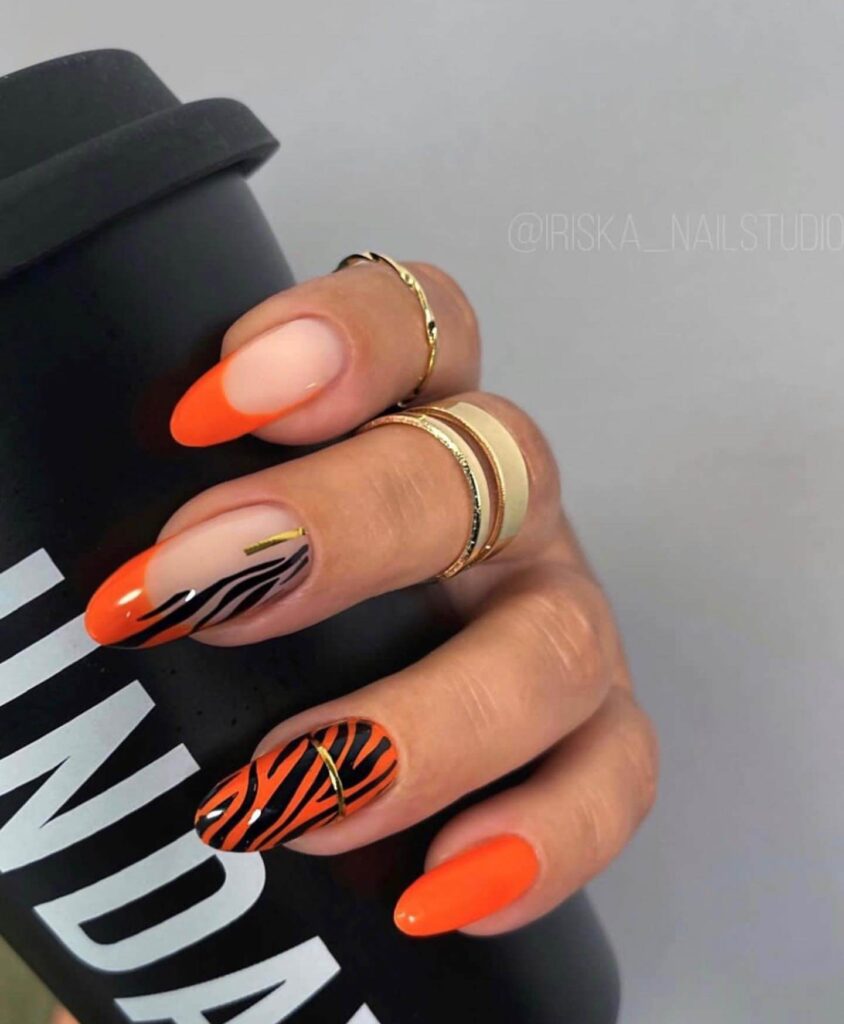 Stylish dark orange nails featuring chic fall designs perfect for autumn vibes.