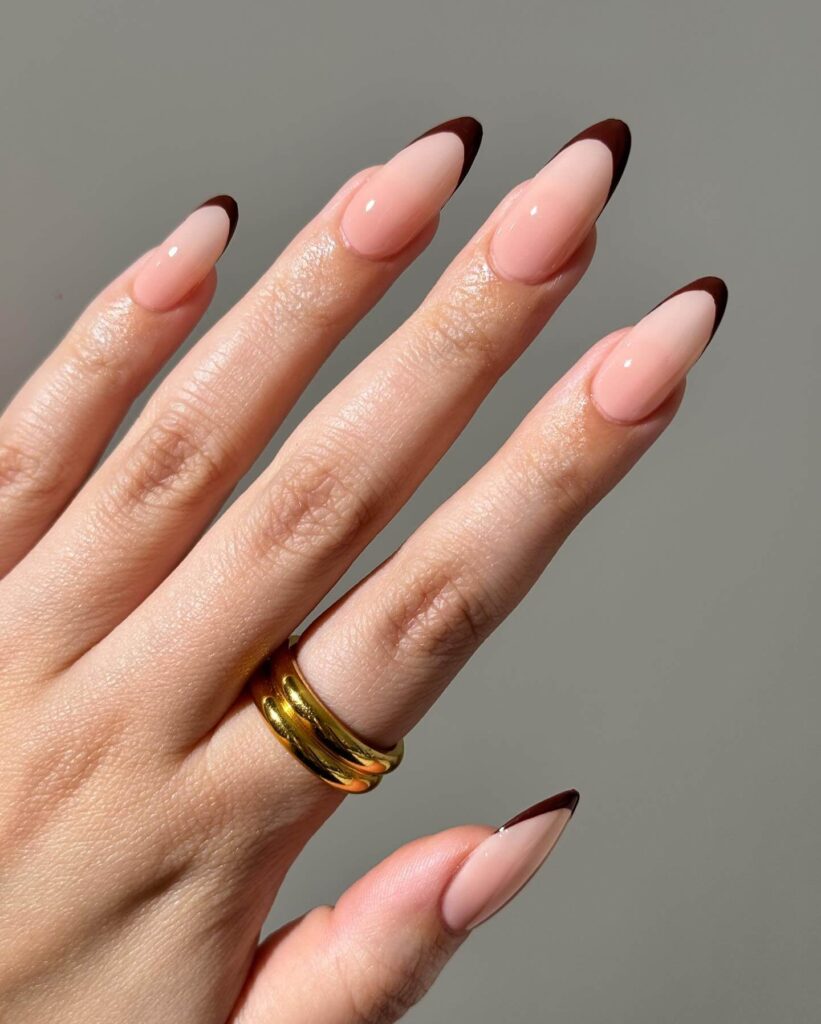 Chic fall french tip nails featuring warm, autumn-inspired colors with elegant, minimalist designs.