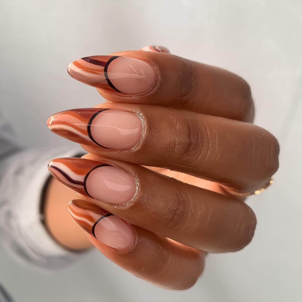 Chic fall french tip nails featuring warm, autumn-inspired colors with elegant, minimalist designs.