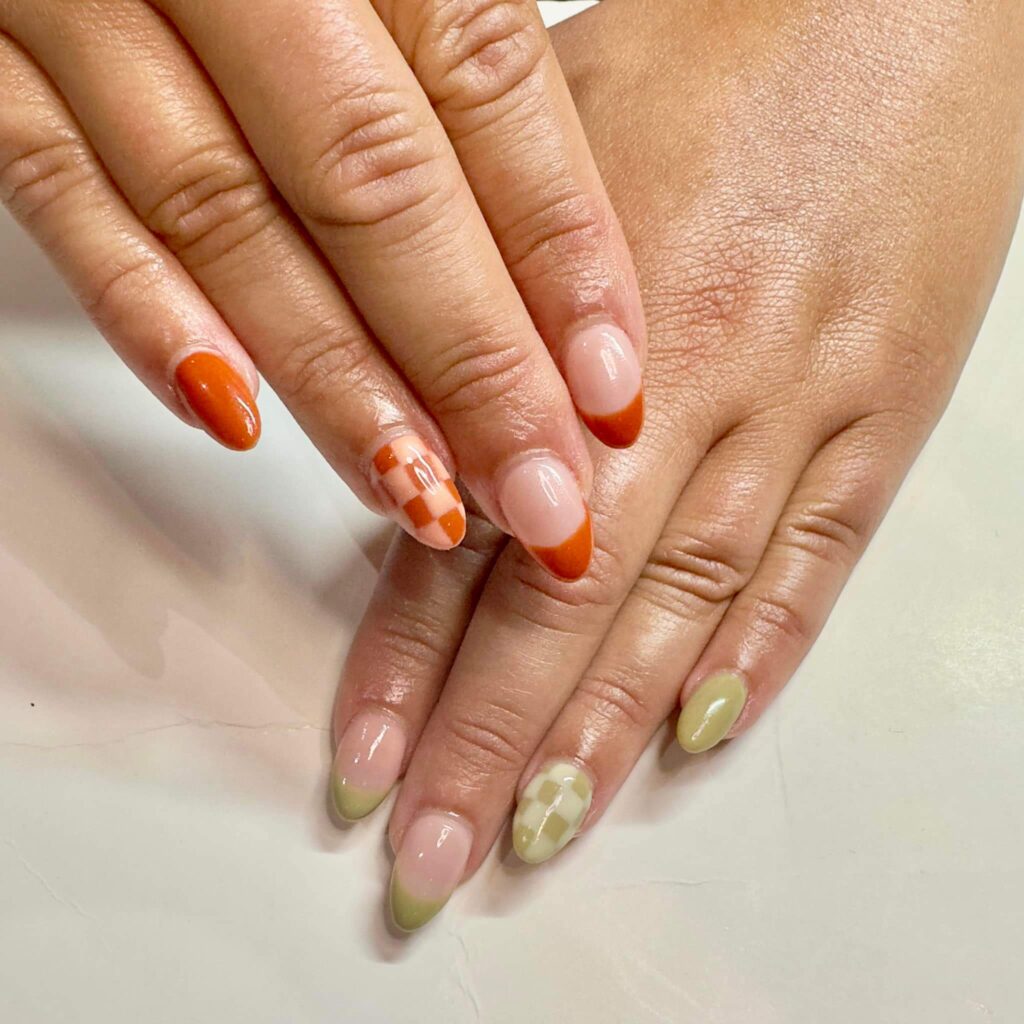 Chic fall french tip nails featuring warm, autumn-inspired colors with elegant, minimalist designs.