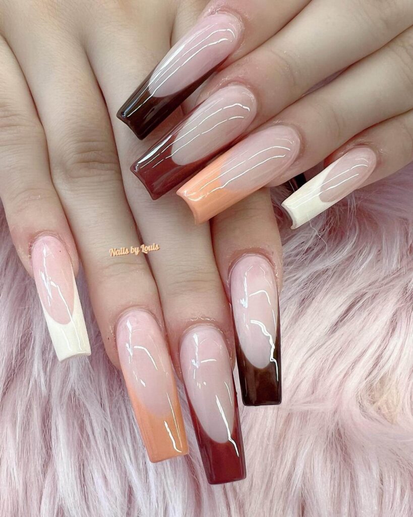 Chic fall french tip nails featuring warm, autumn-inspired colors with elegant, minimalist designs.