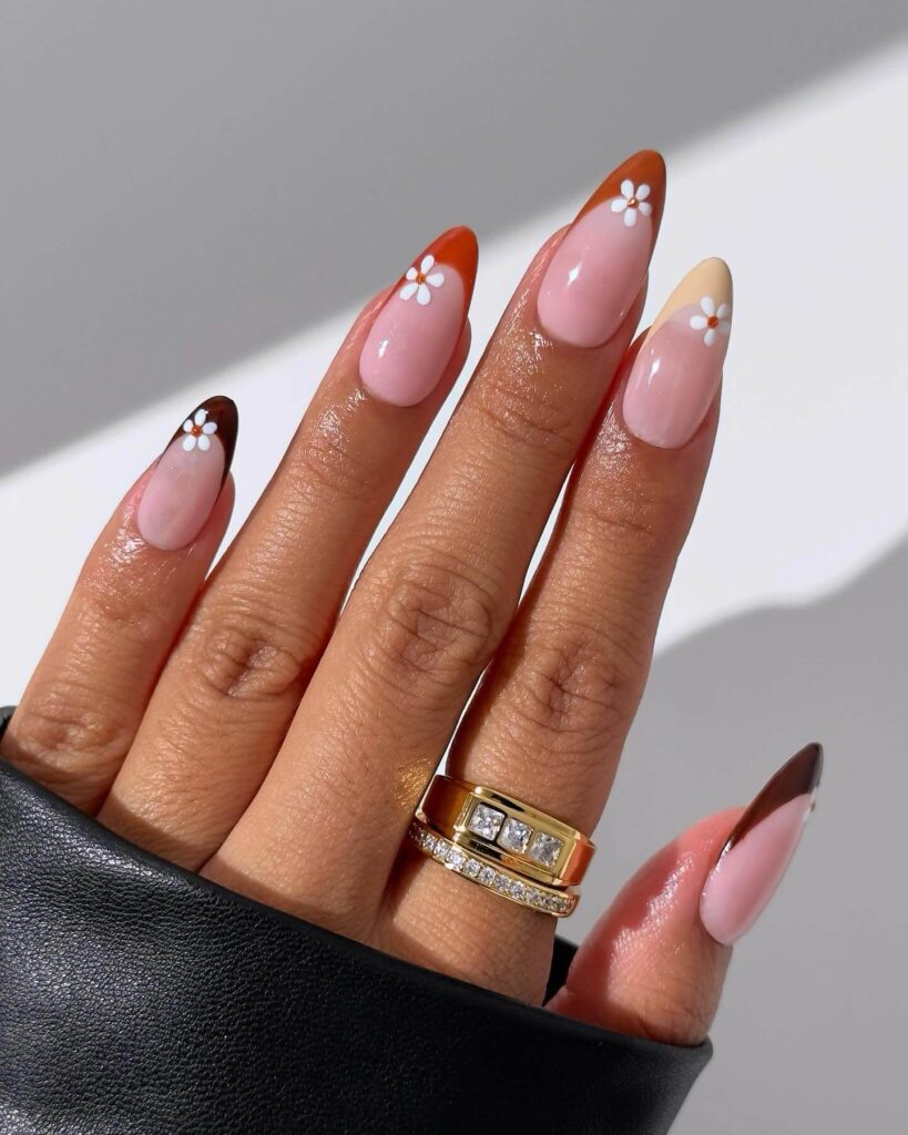 Chic fall french tip nails featuring warm, autumn-inspired colors with elegant, minimalist designs.