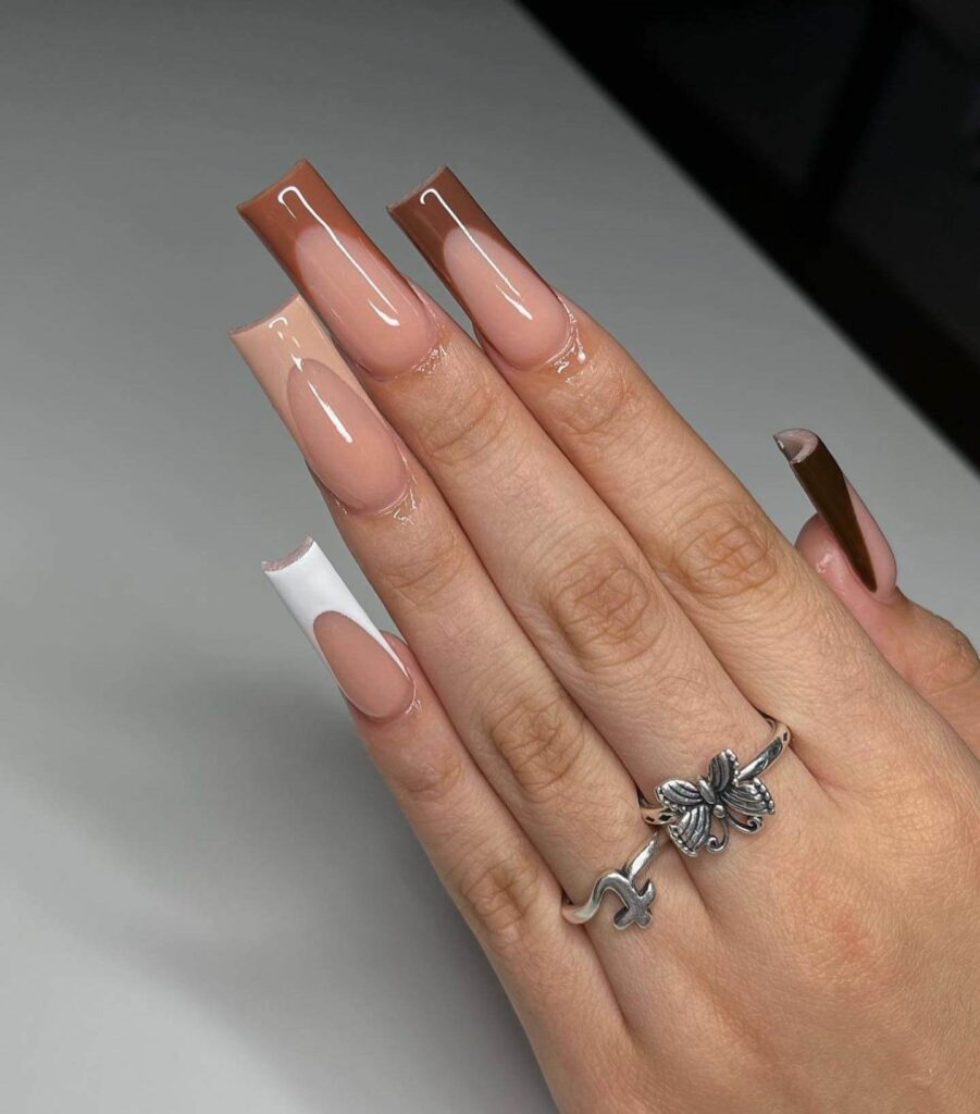 Chic fall french tip nails featuring warm, autumn-inspired colors with elegant, minimalist designs.