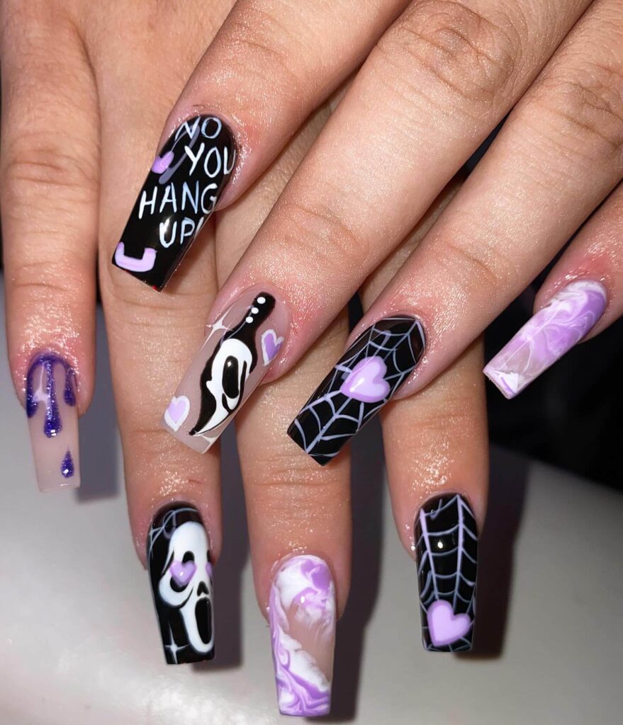 A variety of Halloween nail art designs, featuring ghost nails, pumpkin nails, and spider web nails with a spooky, festive look.