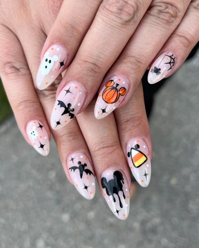 A variety of Halloween nail art designs, featuring ghost nails, pumpkin nails, and spider web nails with a spooky, festive look.