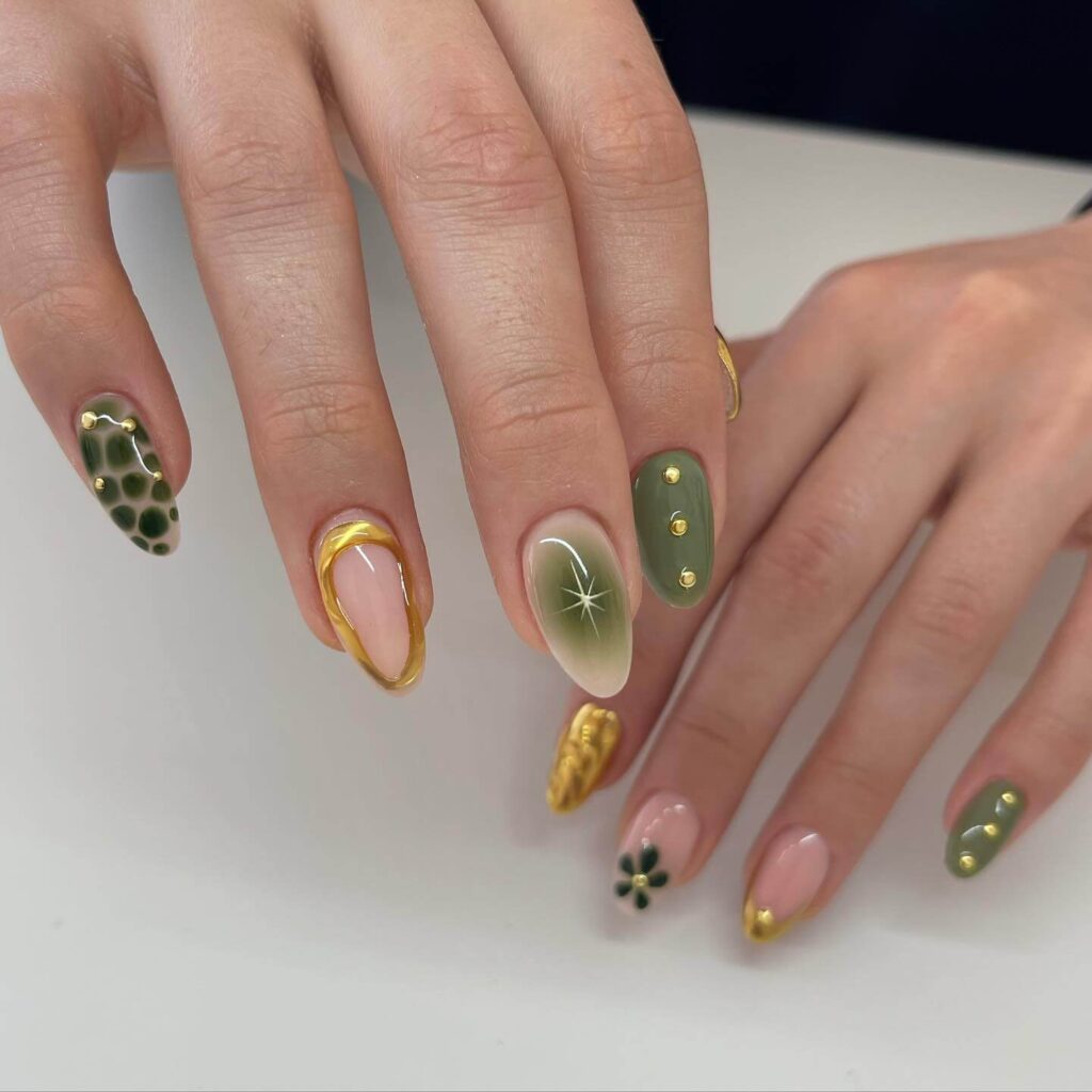 Chic olive green nails featuring gold foil accents and elegant, glossy finishes.