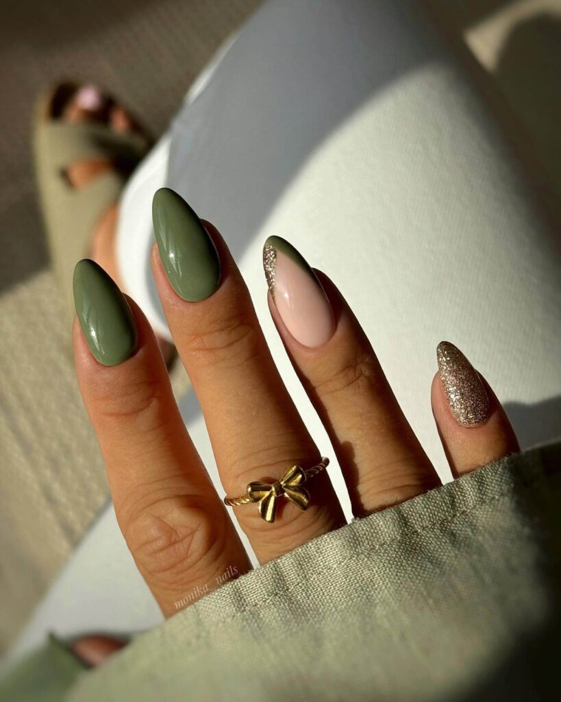 Chic olive green nails featuring gold foil accents and elegant, glossy finishes.