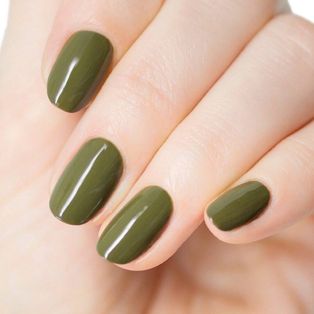 Chic olive green nails featuring gold foil accents and elegant, glossy finishes.