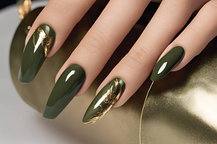 Chic olive green nails featuring gold foil accents and elegant, glossy finishes.