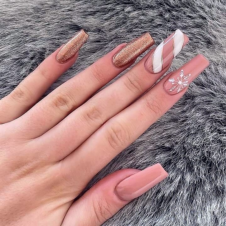 candy cane nails with red and white stripes and glitter accents, perfect for a festive holiday look.