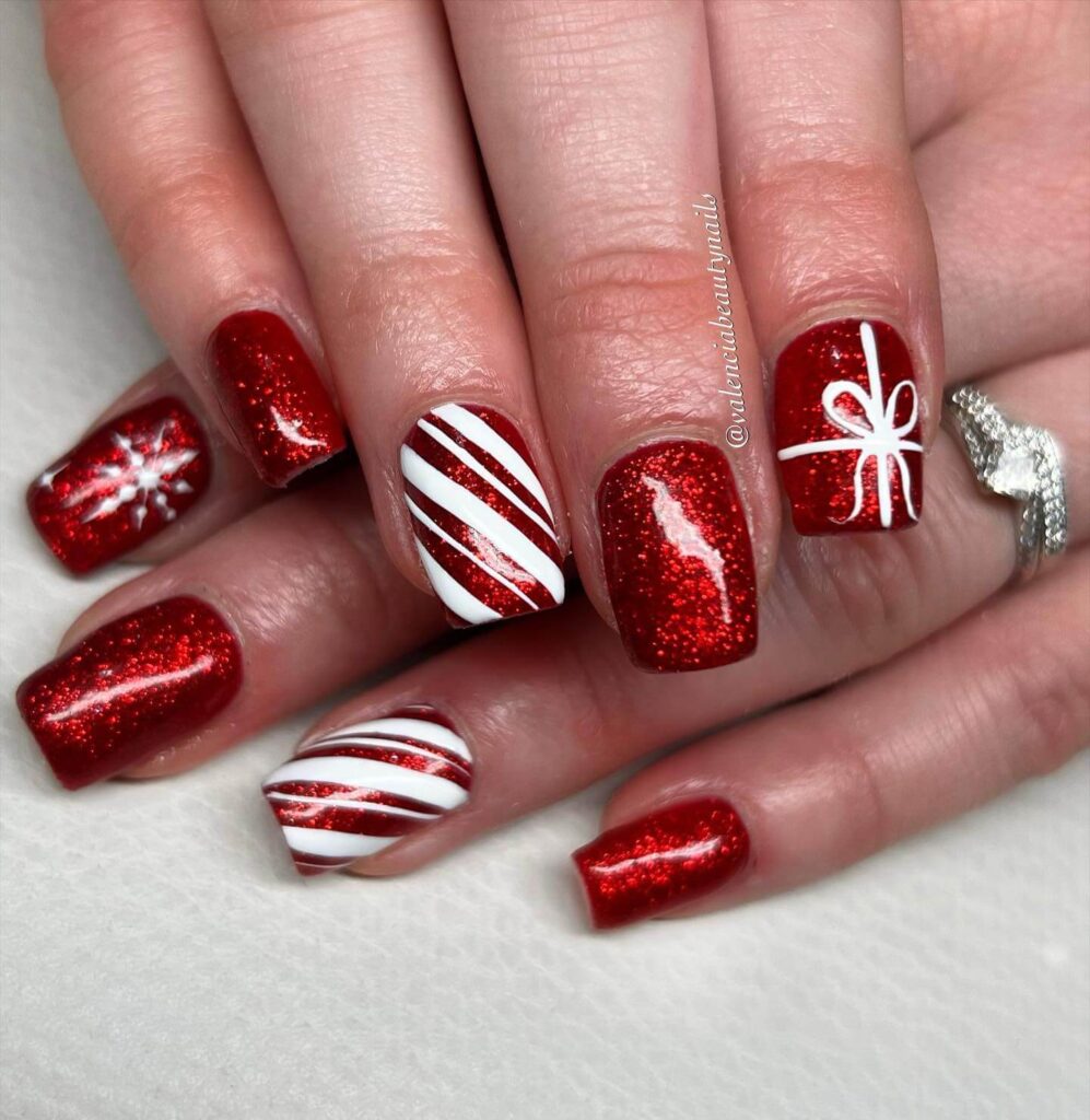 Festive Christmas gel nails featuring red, green, and white designs, including snowflakes, candy cane stripes, and Christmas tree accents.