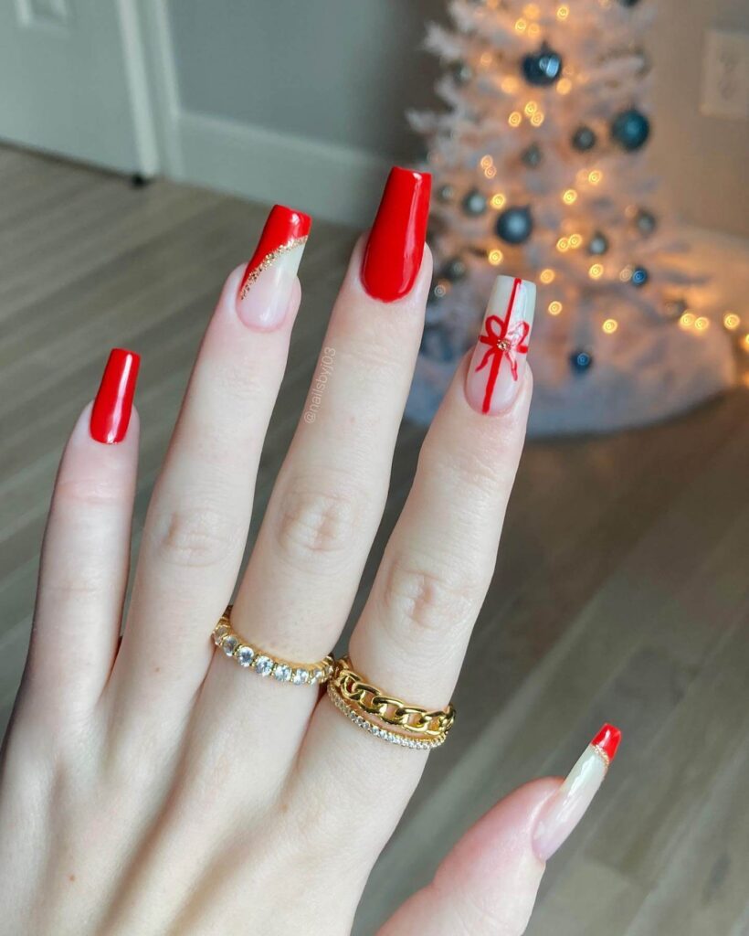 Festive Christmas gel nails featuring red, green, and white designs, including snowflakes, candy cane stripes, and Christmas tree accents.