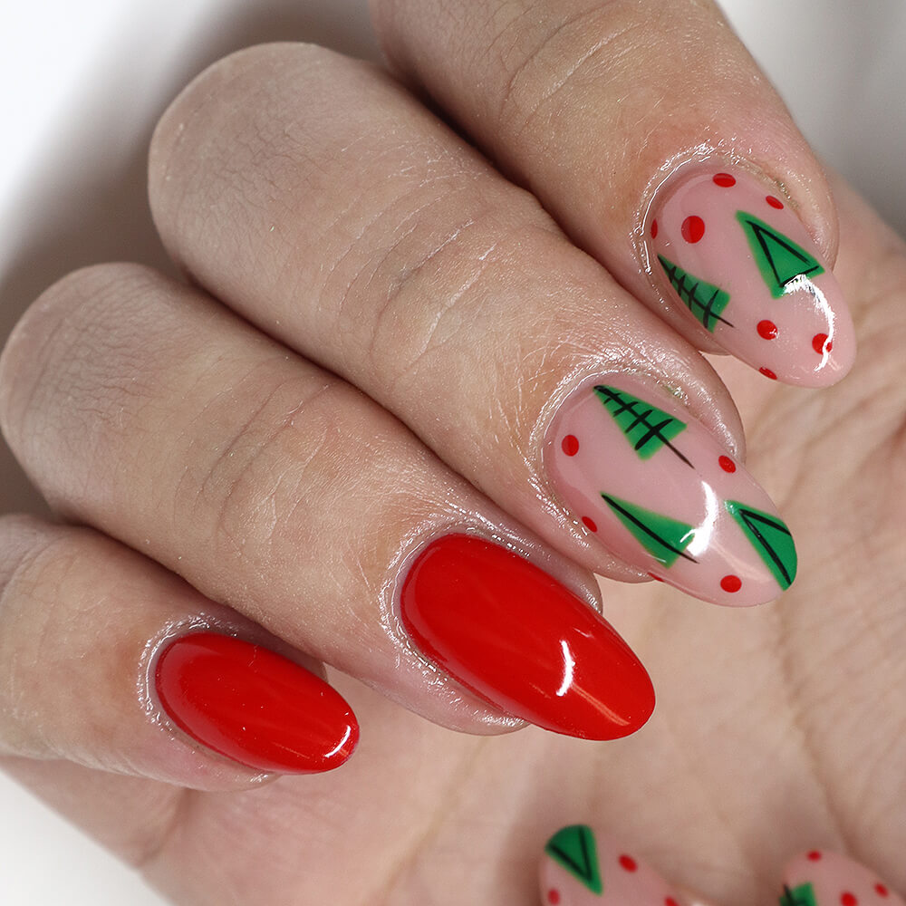 Festive Christmas gel nails featuring red, green, and white designs, including snowflakes, candy cane stripes, and Christmas tree accents.