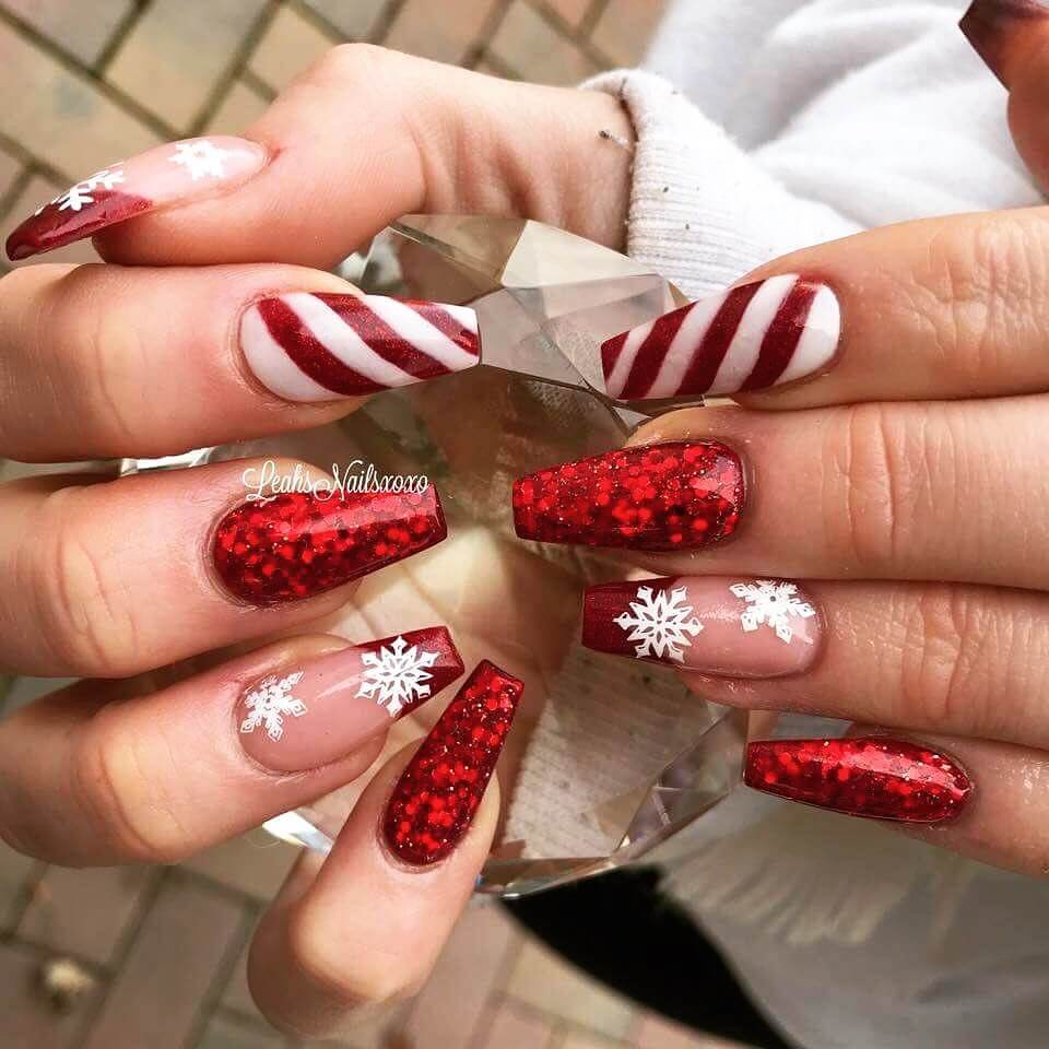 Festive Christmas nail art designs featuring snowflakes, candy cane stripes, and gingerbread nail details.