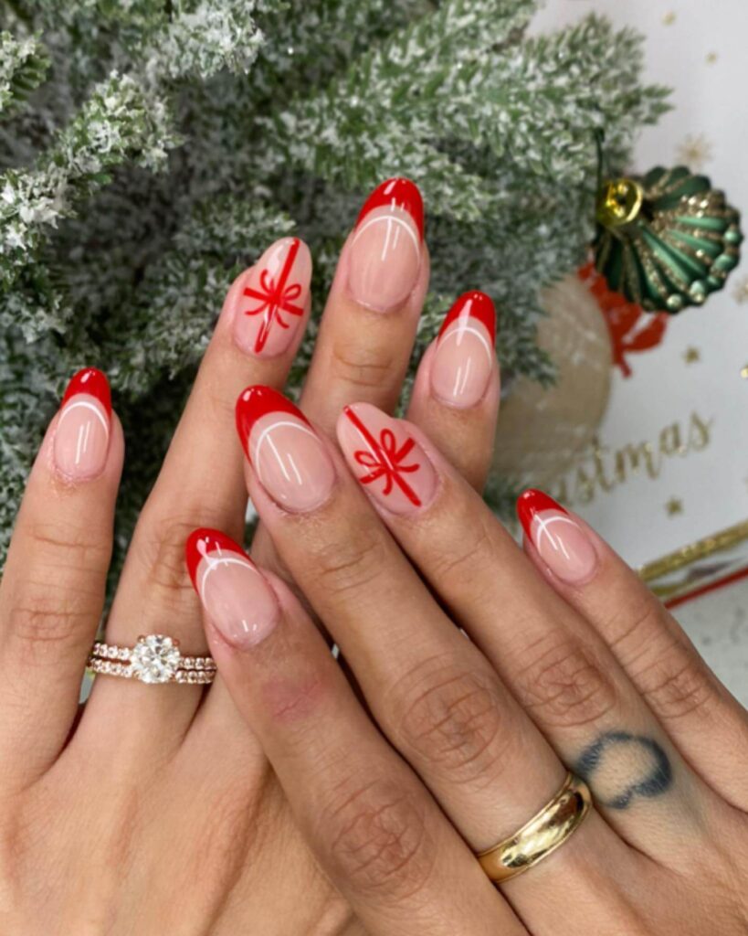 Festive Christmas nail designs featuring red and green nails with glitter accents, snowflakes, and holiday-themed nail art.