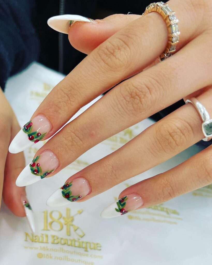 Festive Christmas nail designs featuring red and green nails with glitter accents, snowflakes, and holiday-themed nail art.