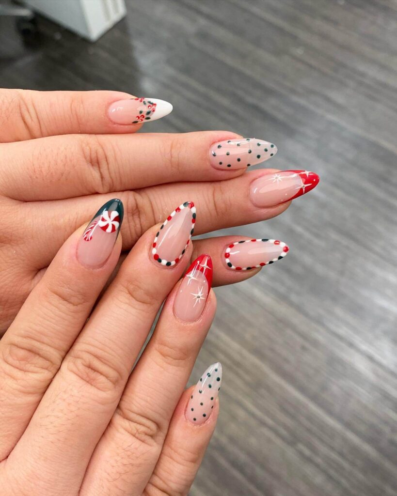 Festive Christmas nail designs featuring red and green nails with glitter accents, snowflakes, and holiday-themed nail art.