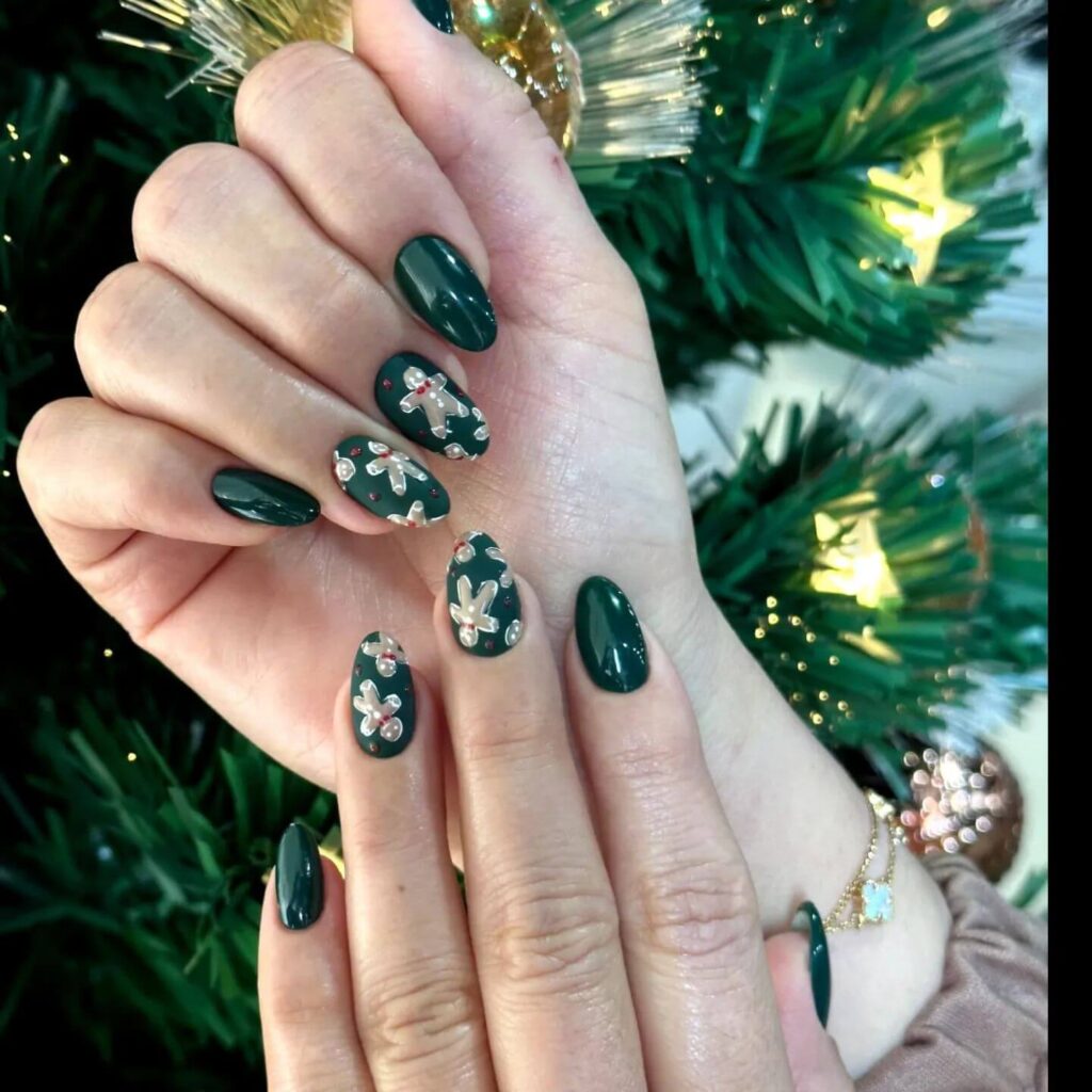 Festive Christmas nail designs featuring red and green nails with glitter accents, snowflakes, and holiday-themed nail art.