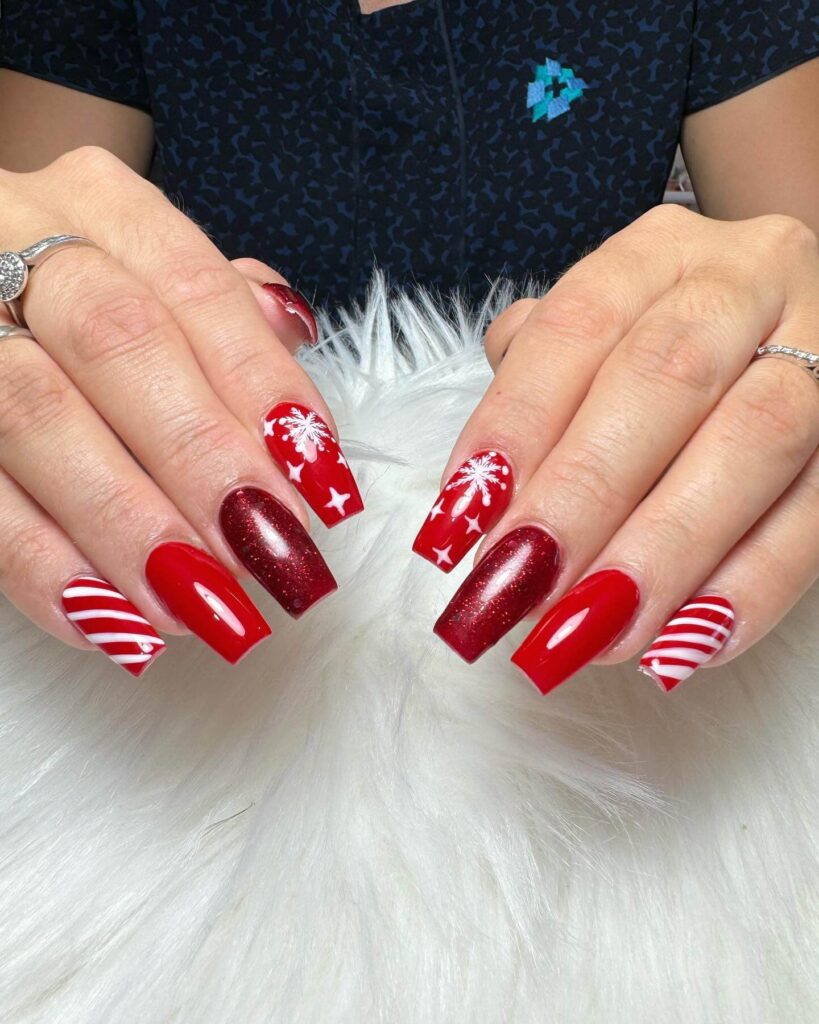 Festive Christmas nail designs featuring red and green nails with glitter accents, snowflakes, and holiday-themed nail art.