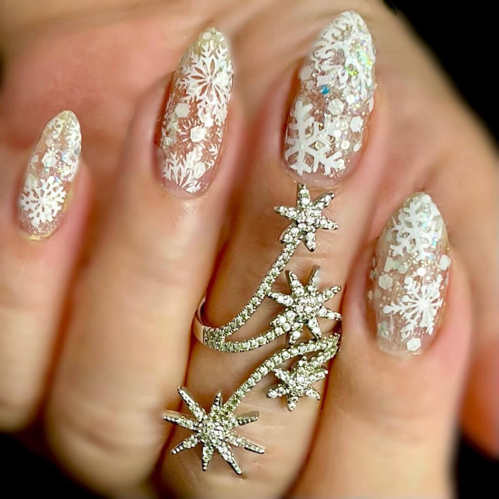 elegant winter nails with blue Christmas nails and delicate snow nail art, perfect for the festive season.