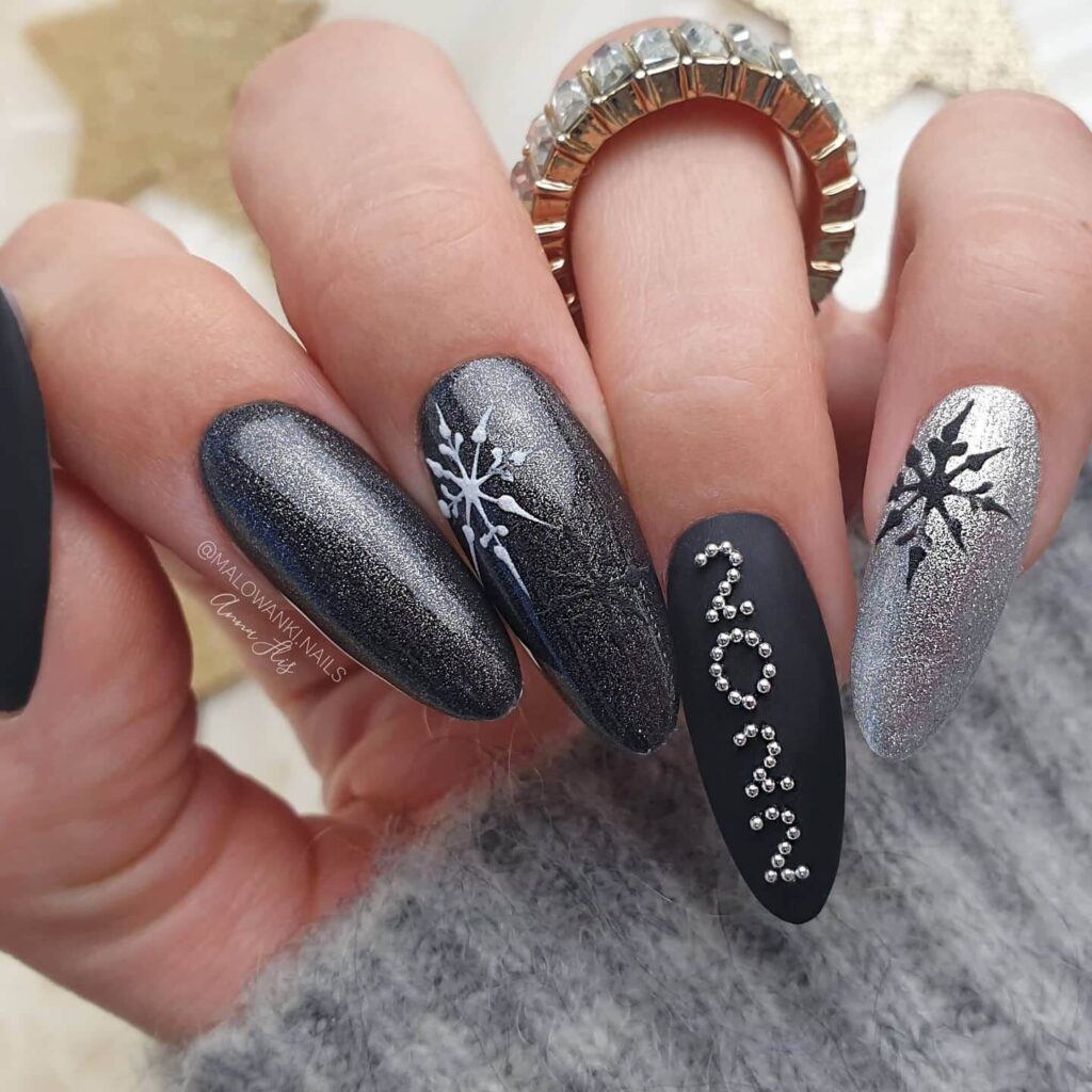 elegant winter nails with blue Christmas nails and delicate snow nail art, perfect for the festive season.