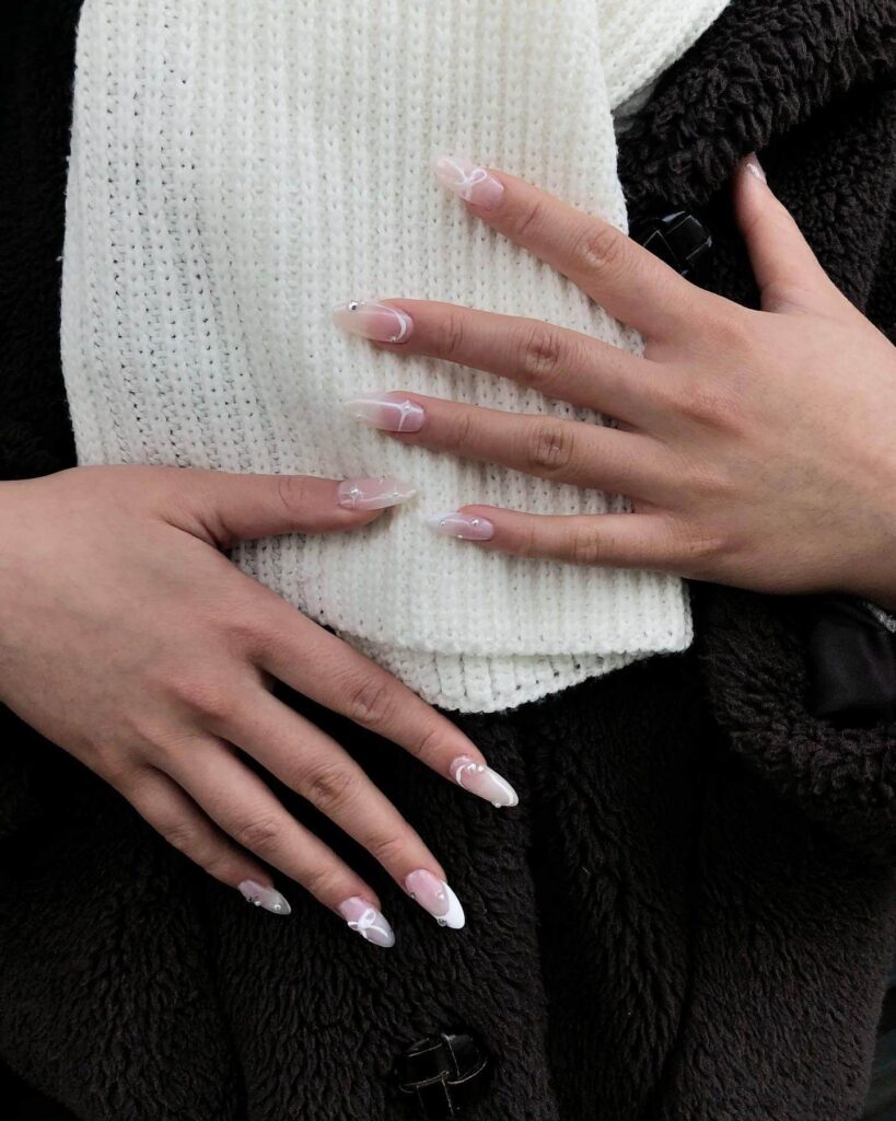 elegant winter nails with blue Christmas nails and delicate snow nail art, perfect for the festive season.