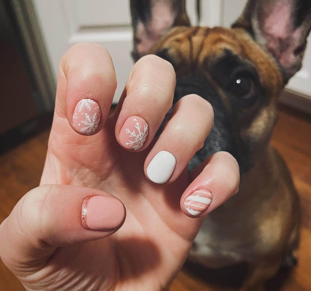 elegant winter nails with blue Christmas nails and delicate snow nail art, perfect for the festive season.