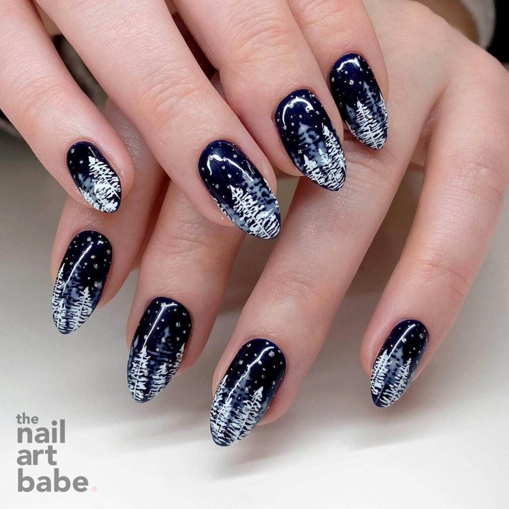 elegant winter nails with blue Christmas nails and delicate snow nail art, perfect for the festive season.