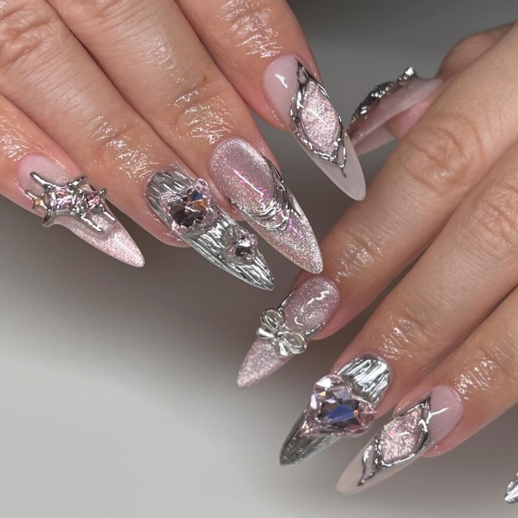 Vibrant nail art featuring mixed rhinestones in various colors and shapes for a unique, eye-catching manicure