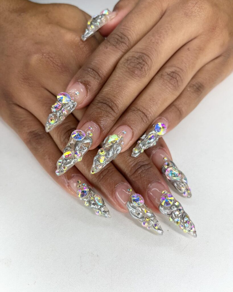 Shine with Swarovski nails! From subtle nude designs to bold blue and pink rhinestones, explore dazzling nail art perfect for every occasion and style.