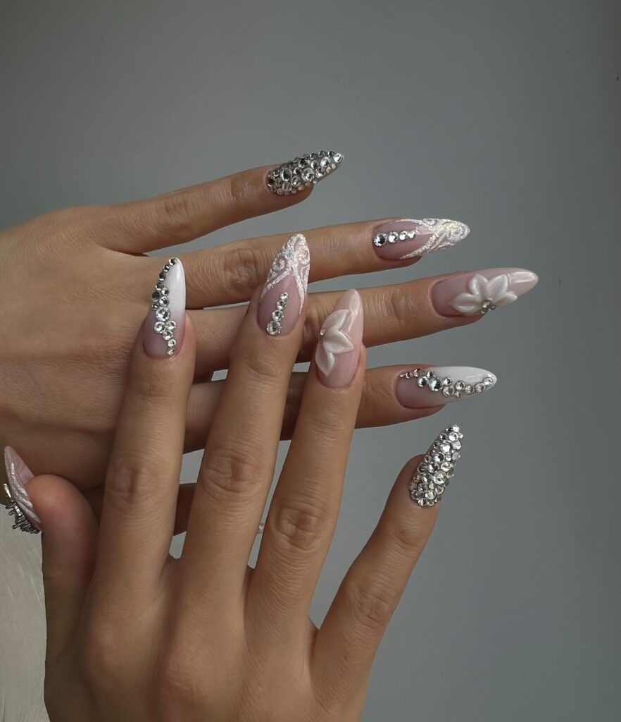 Shine with Swarovski nails! From subtle nude designs to bold blue and pink rhinestones, explore dazzling nail art perfect for every occasion and style.