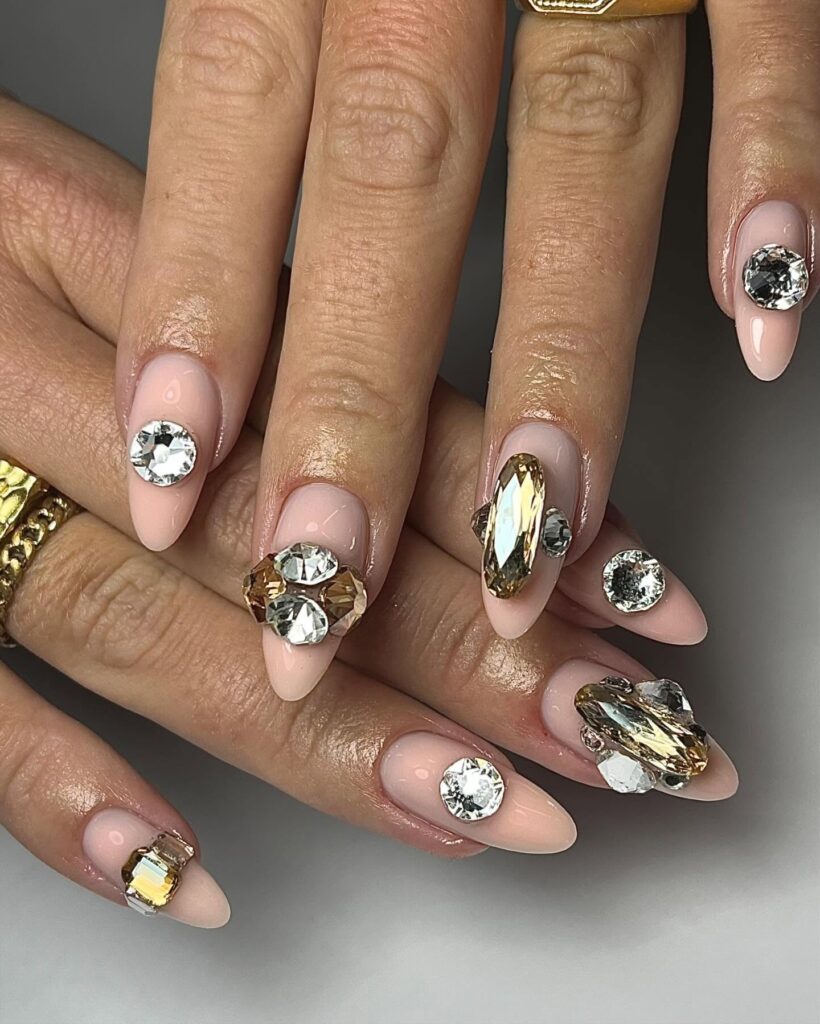 Shine with Swarovski nails! From subtle nude designs to bold blue and pink rhinestones, explore dazzling nail art perfect for every occasion and style.