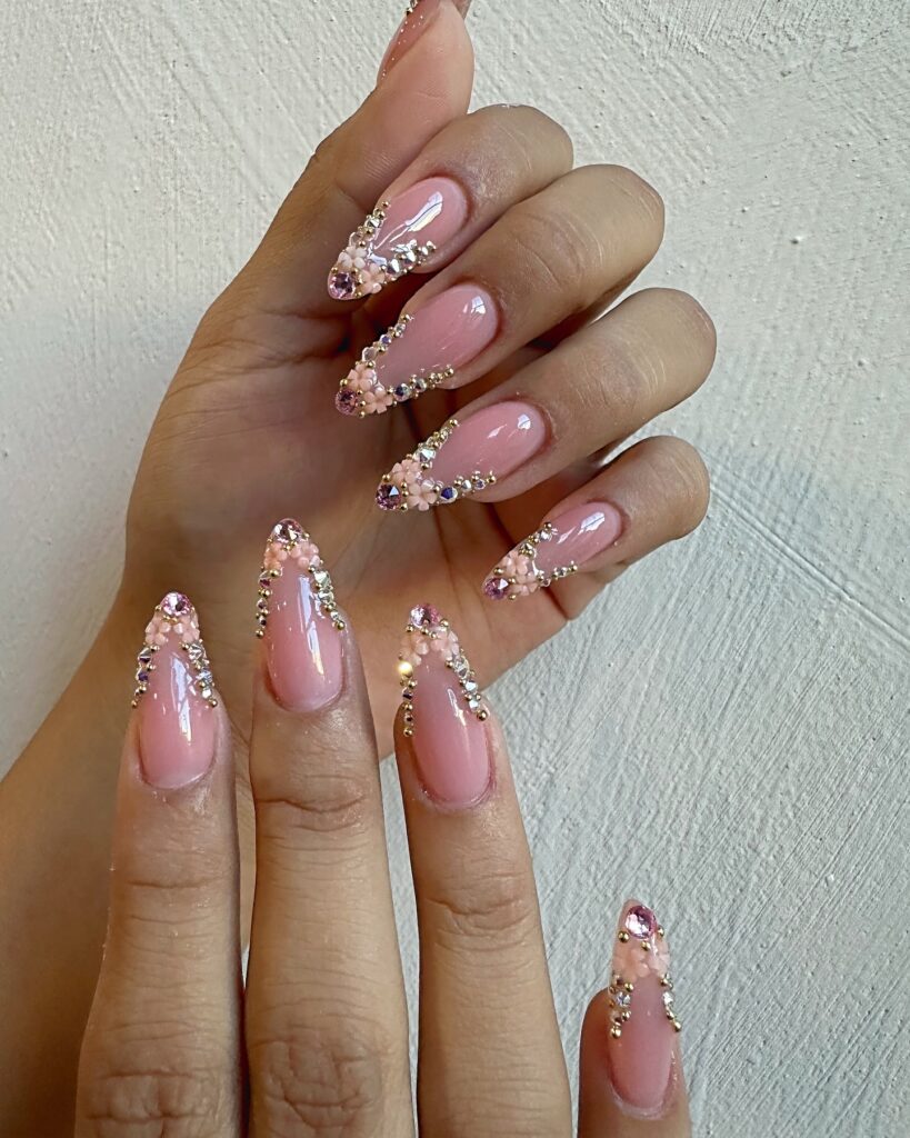 Shine with Swarovski nails! From subtle nude designs to bold blue and pink rhinestones, explore dazzling nail art perfect for every occasion and style.